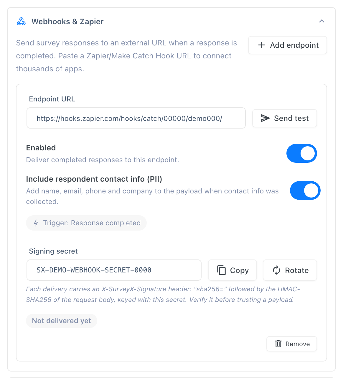 One endpoint card in the Webhooks & Zapier section, showing the Endpoint URL field, the Enabled and Include respondent contact info (PII) toggles, the Send test button, and the read-only Signing secret field with its Copy and Rotate buttons